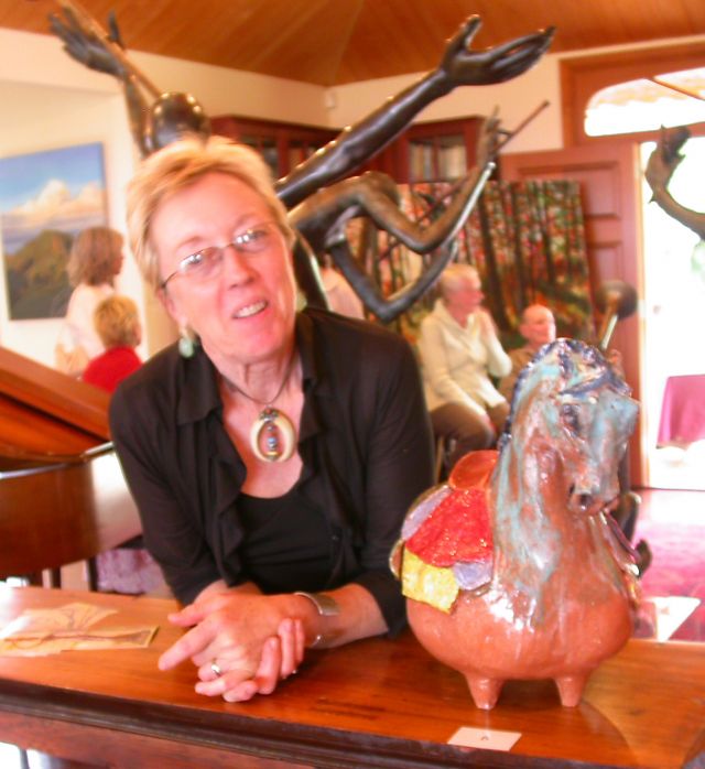 Sue in front of some of Frank's bronze works
